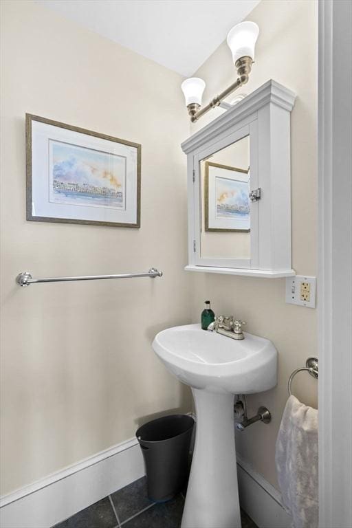 bathroom with tile patterned floors