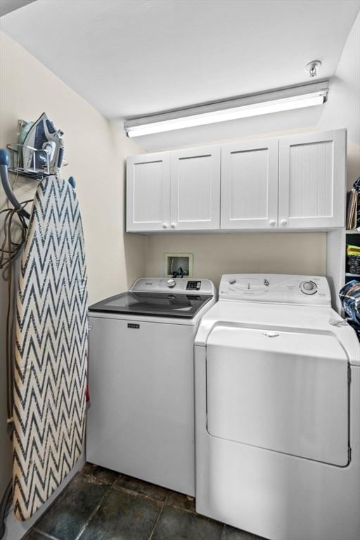 laundry area featuring cabinets and independent washer and dryer