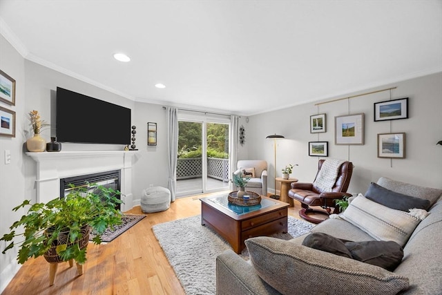 2 Darby Pt Unit 2, Mashpee, MA 02649 - living room featuring ornamental molding, wood finished floors, a glass covered fireplace, and recessed lighting