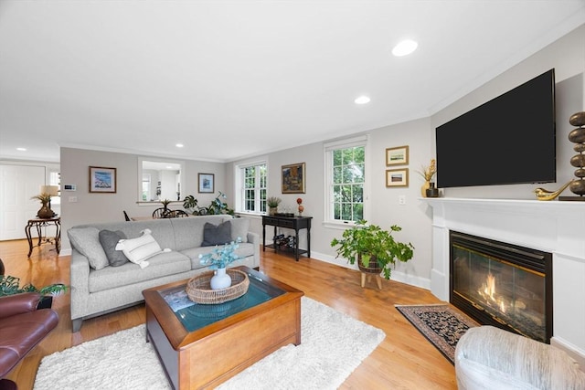 2 Darby Pt Unit 2, Mashpee, MA 02649 - living room with a fireplace with flush hearth, crown molding, wood finished floors, and recessed lighting