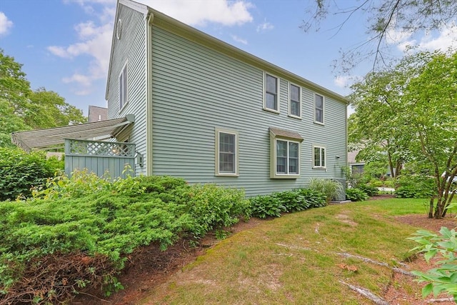 2 Darby Pt Unit 2, Mashpee, MA 02649 - view of side of home featuring a lawn