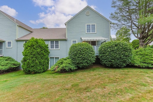 2 Darby Pt Unit 2, Mashpee, MA 02649 - rear view of house featuring a lawn