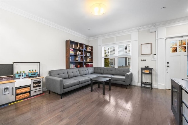 living area with ornamental molding and dark wood-style floors