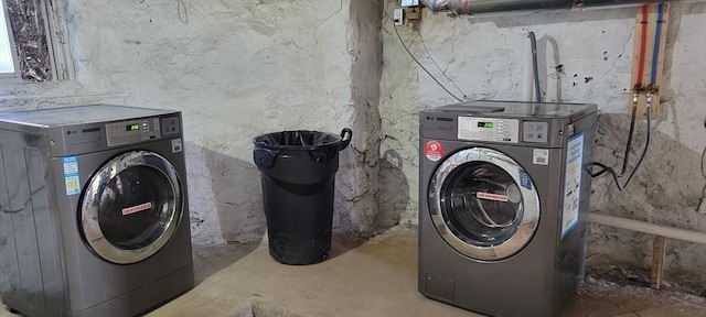 laundry room with washing machine and clothes dryer