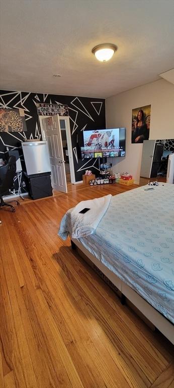 bedroom featuring wood finished floors