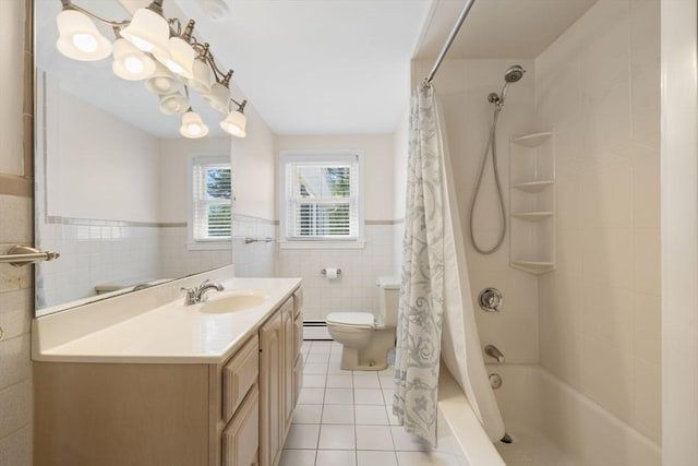 full bath featuring tile walls, tile patterned floors, a baseboard radiator, toilet, and vanity