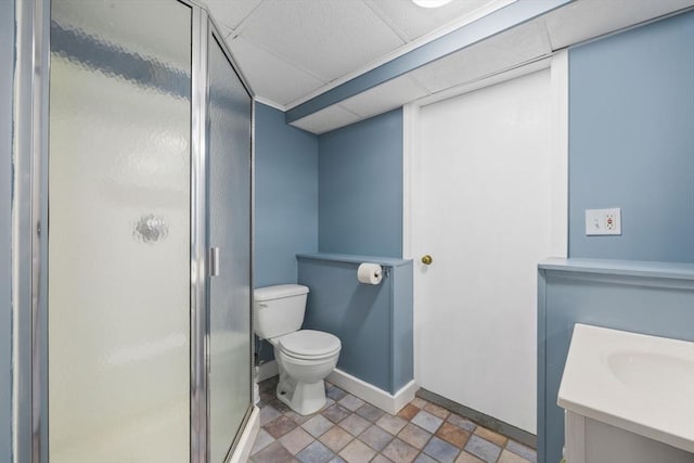 full bath featuring a stall shower, toilet, and vanity