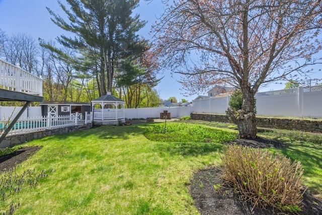 view of yard featuring a gazebo and an outdoor structure