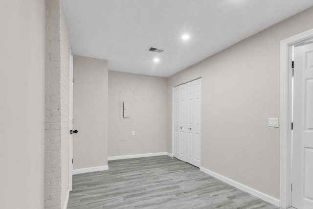 interior space featuring light hardwood / wood-style floors and electric panel