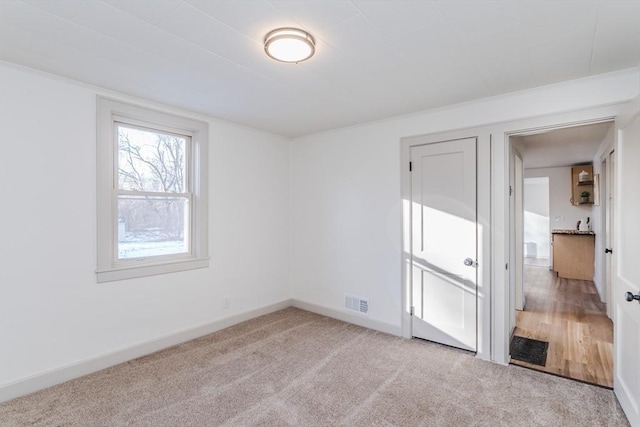 empty room with light colored carpet