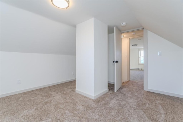 bonus room with light colored carpet, lofted ceiling, and a baseboard radiator