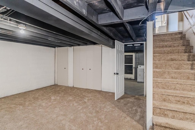 basement with washer / clothes dryer and carpet flooring