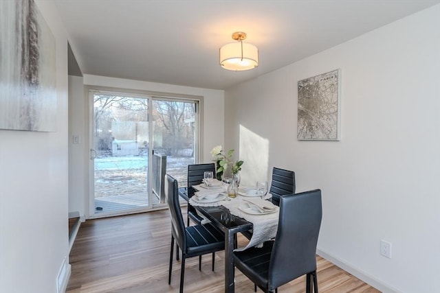 dining room with hardwood / wood-style floors