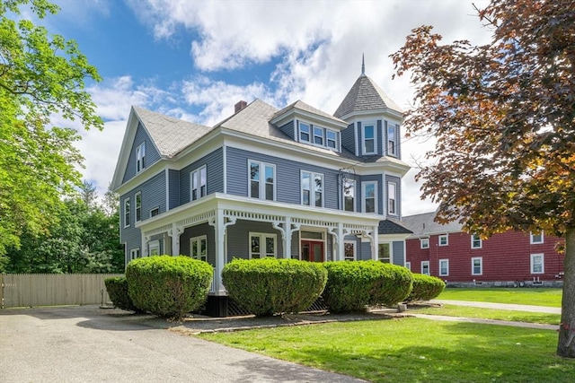 42 Middlesex St, Chelmsford, MA 01863 - victorian home featuring a chimney and a porch