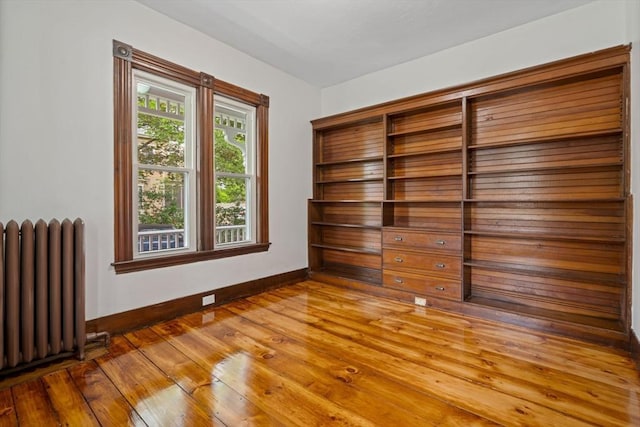 42 Middlesex St, Chelmsford, MA 01863 - unfurnished room with radiator heating unit, baseboards, and wood finished floors
