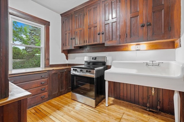42 Middlesex St, Chelmsford, MA 01863 - kitchen with stainless steel electric range oven and light wood finished floors