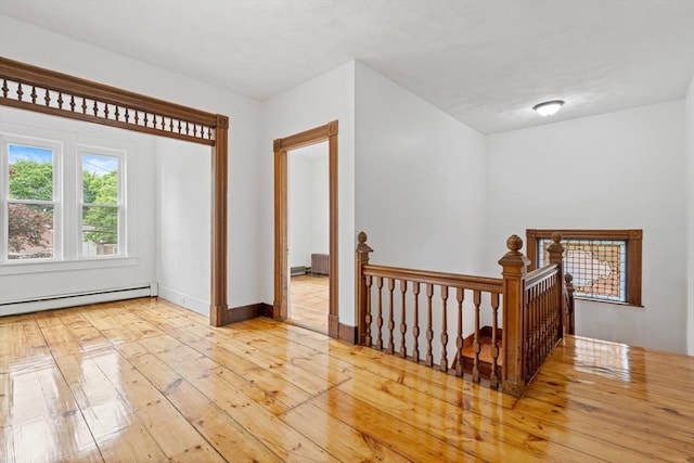 42 Middlesex St, Chelmsford, MA 01863 - spare room with a baseboard radiator, wood-type flooring, and baseboards