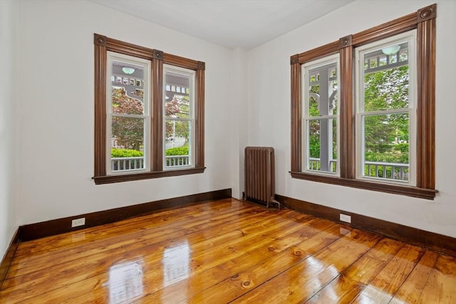 42 Middlesex St, Chelmsford, MA 01863 - unfurnished room featuring radiator heating unit, baseboards, and light wood-style floors