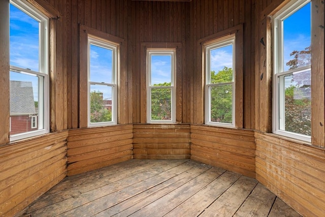 42 Middlesex St, Chelmsford, MA 01863 - unfurnished sunroom with wood walls, wood-type flooring, and healthy amount of natural light