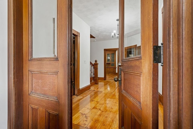 42 Middlesex St, Chelmsford, MA 01863 - corridor featuring light wood-style flooring and baseboards
