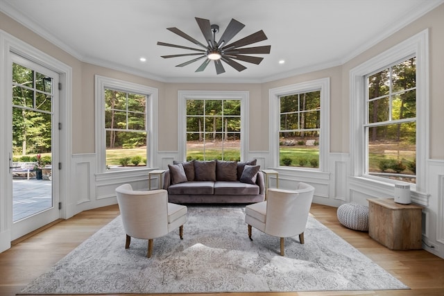 sunroom featuring ceiling fan