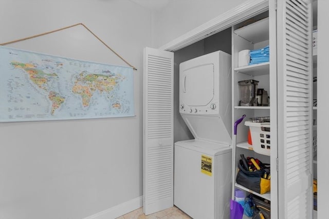 laundry area featuring stacked washer and clothes dryer