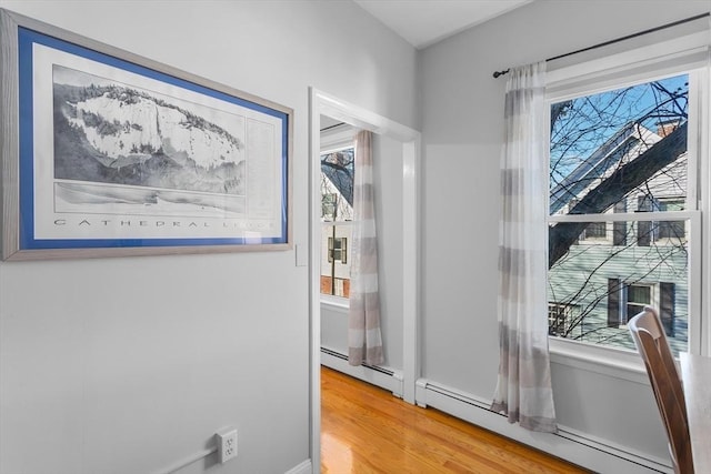 interior space featuring hardwood / wood-style floors and baseboard heating