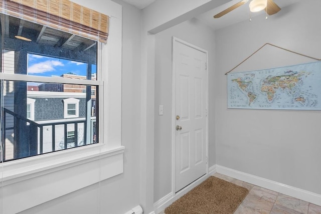 entryway featuring a wealth of natural light and ceiling fan