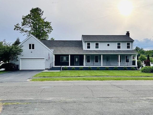 35 E Glen Dr, Westfield, MA 01085 - view of front of property featuring a porch, driveway, a chimney, and a front yard