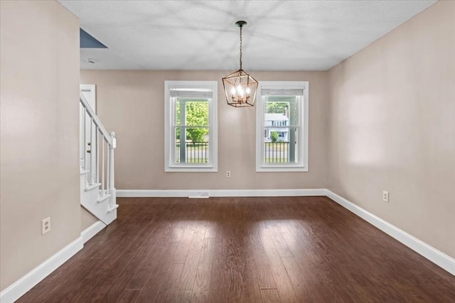 35 E Glen Dr, Westfield, MA 01085 - unfurnished dining area with stairway, a chandelier, baseboards, and dark wood finished floors