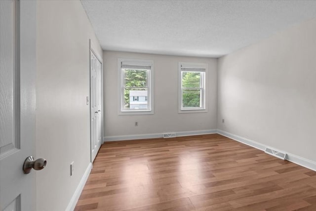 35 E Glen Dr, Westfield, MA 01085 - unfurnished room featuring light wood-style flooring, a textured ceiling, and baseboards