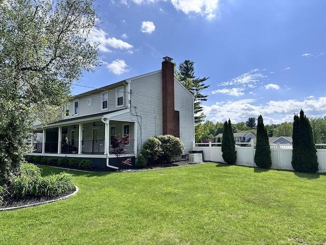 35 E Glen Dr, Westfield, MA 01085 - back of house with central air condition unit, a chimney, and covered porch