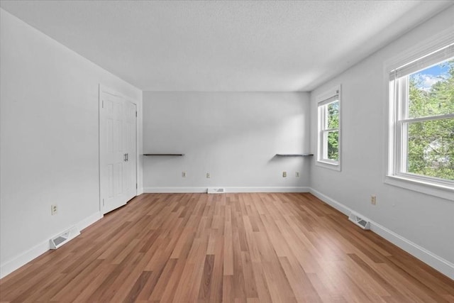 35 E Glen Dr, Westfield, MA 01085 - unfurnished room featuring light wood-type flooring, baseboards, and a textured ceiling