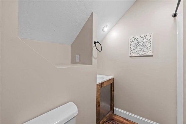 35 E Glen Dr, Westfield, MA 01085 - half bath with toilet, vanity, wood finished floors, and baseboards