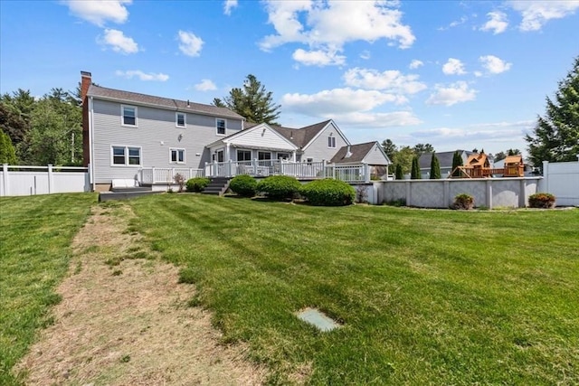 35 E Glen Dr, Westfield, MA 01085 - back of property featuring a deck and a chimney