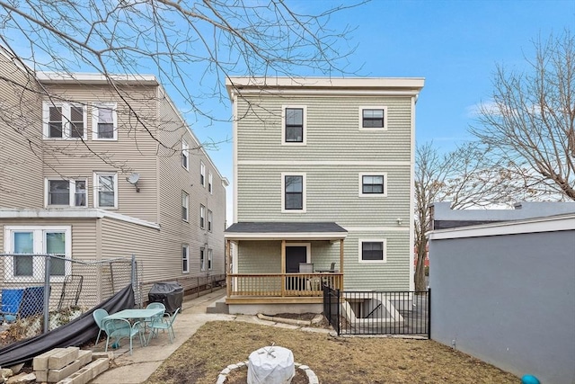 back of property with a patio area and a fenced backyard