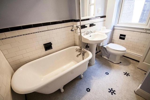 6 Stillman Pl, Boston, MA 02113 - full bath with tile walls, baseboard heating, a freestanding bath, and a wainscoted wall