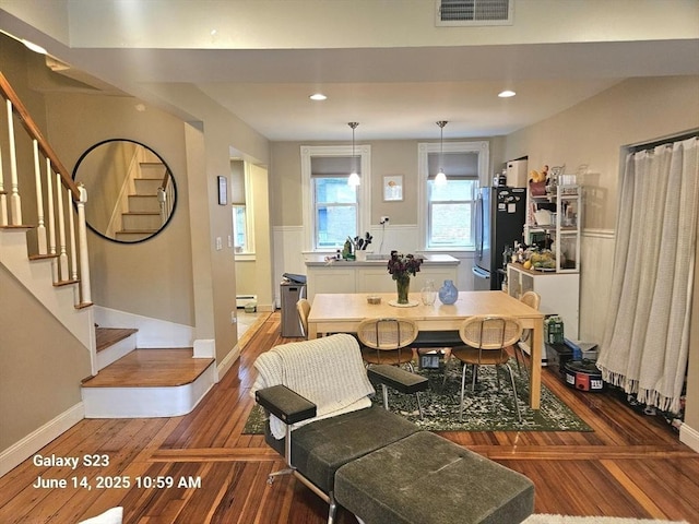 6 Stillman Pl, Boston, MA 02113 - dining room with stairs, a baseboard heating unit, wood finished floors, and recessed lighting