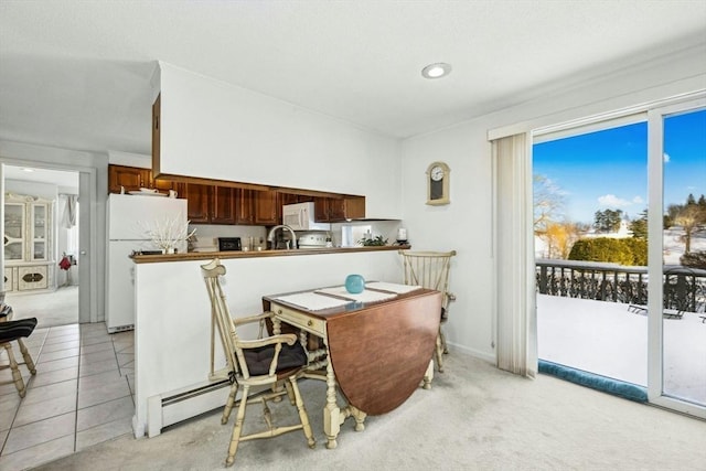 dining room with light tile patterned flooring and light colored carpet