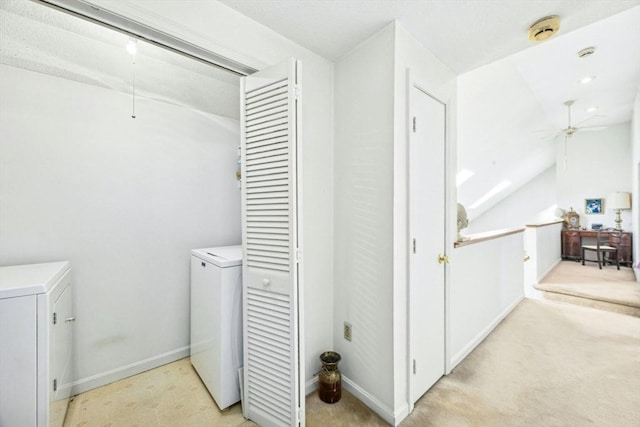 laundry area featuring washer and clothes dryer, light colored carpet, a ceiling fan, attic access, and laundry area