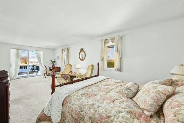 carpeted bedroom featuring access to outside