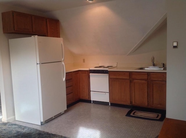 kitchen with brown cabinets, white appliances, light countertops, and a sink