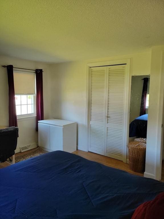 115 Captain Chase Rd, Yarmouth, MA 02664 - bedroom with a closet and a textured ceiling