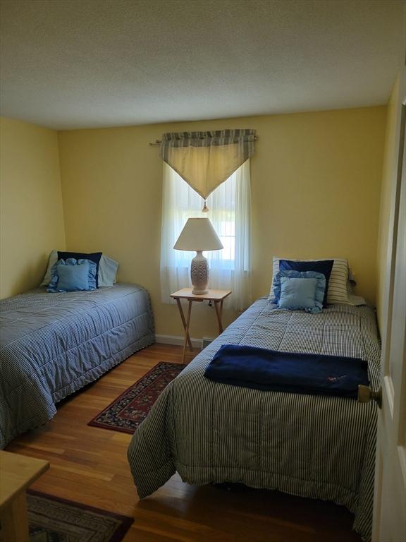 115 Captain Chase Rd, Yarmouth, MA 02664 - bedroom with wood finished floors