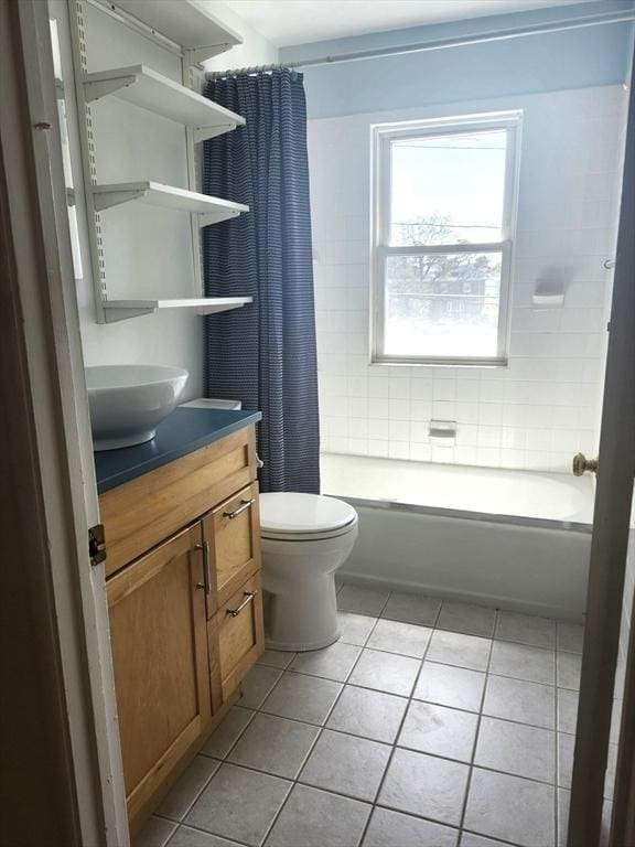 bathroom with tile patterned floors, vanity, toilet, and shower / tub combo