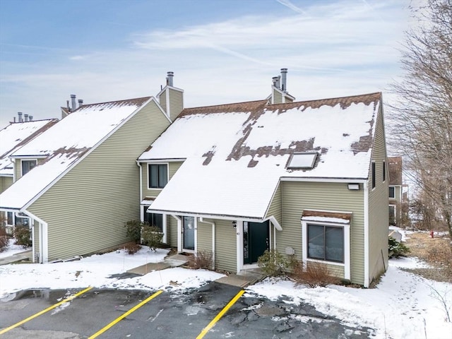 view of snow covered property