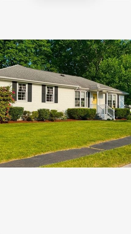 ranch-style house with a front lawn