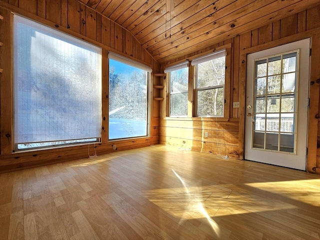 unfurnished sunroom with lofted ceiling and wood ceiling