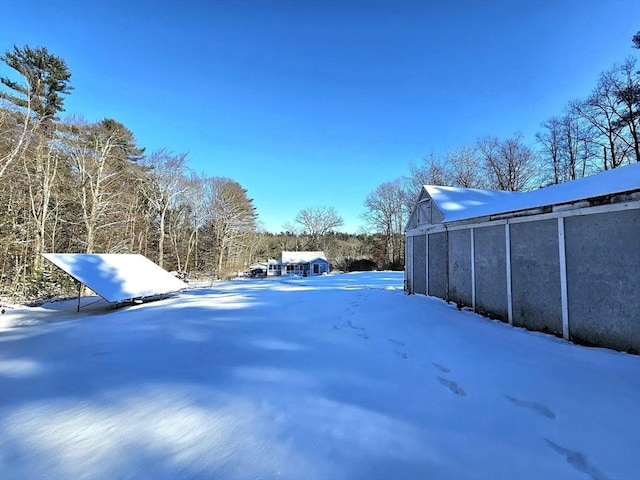 view of yard covered in snow