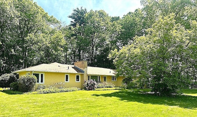 330 Chapin St, Ludlow, MA 01056 - ranch-style house featuring a front lawn and a chimney